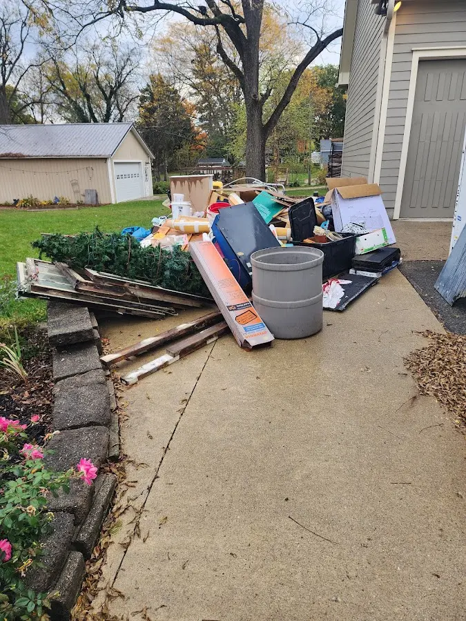 Dumpster being loaded with debris for Commercial Dumpster Rental in Farmville